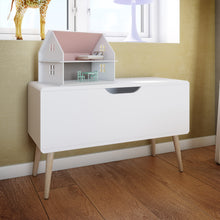 Load image into Gallery viewer, Gaia Toy Box in Pure White Furniture To Go 1013603800058 5707252083199 Introducing the Gaia Toy Box in Pure White: A stylish and secure way to elevate their space. The soft shapes ensure safety while the modern design with oak legs exudes a playful and functional charm. Crafted with durable oak and MDF wood, it adds an elegant touch, and the pure white colour effortlessly complements any children&#39;s room decor. Upgrade their space with the Gaia Toy Box, a versatile piece that provides a chic storage solution