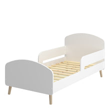 Load image into Gallery viewer, Gaia Toddler Bed 70x140 cm in Pure White Furniture To Go 1013606450058 5707252084530 Introducing the Gaia Toddler Bed in White: Where style meets comfort and safety. The bed&#39;s modern design features oak legs, adding a touch of natural beauty to your little one&#39;s room. Crafted with durable oak and MDF wood in a pristine white hue, it exudes elegance and versatility, effortlessly complementing any nursery decor. Moreover, with soft shapes ensuring safety by preventing dangerous edges, you can rest peacefully,