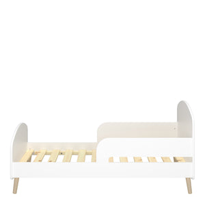 Gaia Toddler Bed 70x140 cm in Pure White Furniture To Go 1013606450058 5707252084530 Introducing the Gaia Toddler Bed in White: Where style meets comfort and safety. The bed's modern design features oak legs, adding a touch of natural beauty to your little one's room. Crafted with durable oak and MDF wood in a pristine white hue, it exudes elegance and versatility, effortlessly complementing any nursery decor. Moreover, with soft shapes ensuring safety by preventing dangerous edges, you can rest peacefully,