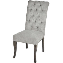 Load image into Gallery viewer, Silver Roll Top Dining Chair With Ring Pull in GREY Hill Interiors 18331 5050140833193 Sumptuous and luxurious design Handcrafted Beautifully made and incredibly stylish White glove delivery Dimensions: 105cm x 49cm x 71cm Weight: 8.6kg Volume: 0.26CBM This is item is built with a Rubberwood Frame, Known for its dense grain and strength, it is perfect for this item. The Fabric is comprised of Nylon and Polyester. All upholstered items have passed UK fire safety regulations with cigarette and match test cert