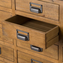 Load image into Gallery viewer, The Draftsman Collection 20 Drawer Merchant Chest in BROWN Hill Interiors 19529 5050140952993 Characterful pine plank construction Handcrafted Solid well made natural furniture White glove delivery Dimensions: 90cm x 160cm x 45cm Weight: 55.8kg Volume: 0.809CBM The combination of raw and organic textures of a solid pine body and cast iron accents has been used in the Draftsman Collection. This is the Draftsman Collection 20 Drawer Merchant Chest which is 90cm high, 160cm wide and 45cm deep with 20 drawers m