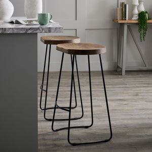 Franklin Hardwood Shaped Barstool in BROWN Hill Interiors 19924 5050140992494 Industrial styling Handcrafted Beautifully made and incredibly stylish Dimensions: 75cm x 40cm x 35cm Weight: 6.54kg Volume: 0.16CBM This is the Franklin Hardwood Shaped Barstool, it features a hardwood seat and complementing metal legs and frame. This bar stool design is hugely popular and would complement an extensive range of interiors including a kitchen, bar, restaurant or hotel. Featuring a shaped seat this barstool is a com