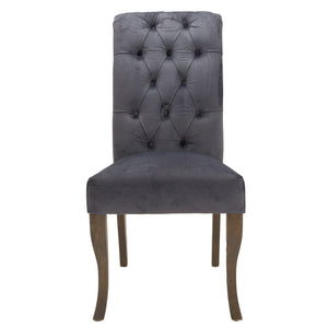 Knightsbridge Roll Top Dining Chair in GREY Hill Interiors 21510 5050140151082 Sumptuous velvet Handcrafted Ring back detailing White glove delivery Dimensions: 105cm x 49cm x 71cm Weight: 7.9kg Volume: 0.26CBM This is the Knightsbridge Roll Top Dining Chair. A sumptuous button pressed velvet chair in a timeless gret colour with roll-top detail and silver ring pull that will add elegance and class to a variety of interiors. Built from a rubberwood frame, known for its dense grain and strength, it is a sturd
