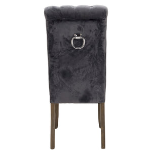 Knightsbridge Roll Top Dining Chair in GREY Hill Interiors 21510 5050140151082 Sumptuous velvet Handcrafted Ring back detailing White glove delivery Dimensions: 105cm x 49cm x 71cm Weight: 7.9kg Volume: 0.26CBM This is the Knightsbridge Roll Top Dining Chair. A sumptuous button pressed velvet chair in a timeless gret colour with roll-top detail and silver ring pull that will add elegance and class to a variety of interiors. Built from a rubberwood frame, known for its dense grain and strength, it is a sturd