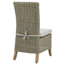 Load image into Gallery viewer, Capri Collection Outdoor Dining Chair in BEIGE Hill Interiors 22951 5050140295182 White glove delivery Dimensions: 103cm x 48cm x 60cm Weight: 13.2kg Volume: 0.16CBM This is the Capri Collection Outdoor Dining Chair. Arriving Spring &#39;24, this premium quality HDPE outdoor wicker dining chair is the perfect blend of style and durability. Every detail of its construction has been built with your long-lasting enjoyment in mind. 
With a frame built from lightweight yet sturdy powder coated aluminium, it is prote