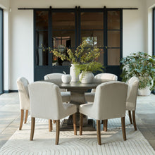 Load image into Gallery viewer, Lucia Collection Round Dining Table in GREY Hill Interiors 22967 5050140296783 White glove delivery Dimensions: 78cm x 150cm x 150cm Weight: 73.22kg Volume: 0.69CBM This is the Lucia Collection Dining Table. Part of the luxurious and impactful Lucia furniture range, the Lucia Round Dining Table commands attention in any interior setting thanks to its distinctive design with chunky silhouette. Each piece is individually handcrafted in hard wood (acacia) by skilled artisans to sculpt the striking design and f