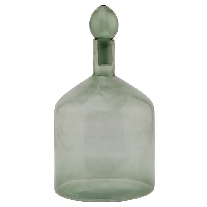 Smoked Sage Glass Bottle With Stopper in SAGE Hill Interiors 22981 5050140298183 Dimensions: 33cm x 18cm x 18cm Weight: 0.85kg Volume: 0.1CBM This is the Smoked Sage Glass Bottle With Stopper. This ornamental glassware is a perfect partner to our new Stamford furniture range, injecting some subtle and soothing tones to its display cabinets and surfaces. Matching taller shaped bottle and stopper available for a beautiful staggered height display.