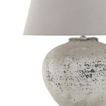 Load image into Gallery viewer, Regola Large Stone Ceramic Lamp in STONE Hill Interiors 23030 5050140303085 Dimensions: 64cm x 49cm x 49cm Weight: 5kg Volume: 0.07CBM This is the Regola Large Stone Ceramic Lamp. A timeless stone effect table lamp with flecked detailing which complete with light grey fabric shade. This elegant table lamp will pair perfectly with both country and modern neutral homes. This lamp takes an E14 screw bulb and comes complete with shade and in-line switch.