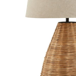 Conical Wicker Table Lamp With Linen Shade in BROWN Hill Interiors 23055 5050140305584 Dimensions: 78cm x 40cm x 40cm Weight: 1.3kg Volume: 0.1CBM This is the Conical Wicker Table Lamp With Linen Shade. A natural wicker lamp, individually handcrafted to a high standard by skilled artisans. This premium quality lamp, complete with linen shade will be a stand out statement piece wherever it's used. 
The high quality natural rattan, paired with linen shade is a timeless look that would add a warming touch to n