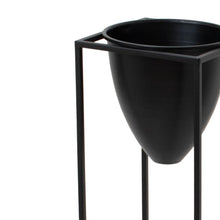 Load image into Gallery viewer, Large Matt Black Bullet Planter On Black Frame in BLACK Hill Interiors 23086 5050140308684 Dimensions: 80cm x 23cm x 23cm Weight: 1.48kg Volume: 0.05CBM This is the Large Black Bullet Planter On Black Frame, a unique and contemporary planter in style and features which is sure to bring an element of design and class into any interior. The black finsh and bullet shade is extremely on trend and when finished with a beautiful bundle of greenery it is sure to create an eye catching piece in any interior. At 80c