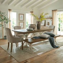 Load image into Gallery viewer, Luna Collection Dining Bench in WHITE Hill Interiors 23113 5050140311387 Dimensions: 46cm x 200cm x 44cm Weight: 22kg Volume: 0.3CBM This is the Luna Collection Dining Bench. Where rustic charm meets contemporary design, the furniture range boasts an off white painted bottom combined with a stained wooden top. It is carefully handcrafted by skilled artisans, highlighting a unique planked pine design enhanced by a warm mid-tone stain. The fusion of this earthy texture with popular white painted legs yields a