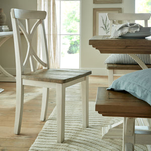 Luna Collection Dining Chair in WHITE Hill Interiors 23114 5050140311486 Dimensions: 102cm x 48cm x 48cm Weight: 7kg Volume: 0.17CBM This is the Luna Collection Dining Chair. Where rustic charm meets contemporary design, the furniture range boasts an off white painted bottom combined with a stained wooden top. It is carefully handcrafted by skilled artisans, highlighting a unique planked pine design enhanced by a warm mid-tone stain. The fusion of this earthy texture with popular white painted legs yields a