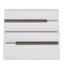 Load image into Gallery viewer, Chelsea 4 Drawer Chest in White with Oak Trim Furniture To Go 4024444 5900355025220 4 drawer chest in white with an Truffle Oak trim. Unconventional design - a proposal for the followers of the latest trends. The clever mix of scratch resistant white melamine with beautiful high gloss fronts and oak melamine trim makes this top quality collection of furniture the ideal destination for the most modern of homes, the massive range that includes many cabinets and wall units fulfils every storage and display opt