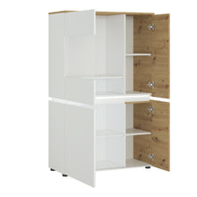 Load image into Gallery viewer, Luci 4 door low display cabinet (including LED lighting) in White and Oak Furniture To Go 4380470 5900355115075 The simplicity of the piece and combination of trendy colours adds timeless style to the Luci collection. This modern vitrine features eight compartments, which are perfect for storage. The vitrine has an ergonomic handleless solution, soft-close accessories and tempered glass – this combination gives you convenience and safety. The Luci collection features integrated lighting (included), which ma