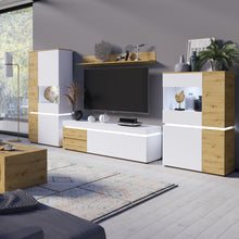 Load image into Gallery viewer, Luci 4 door low display cabinet (including LED lighting) in White and Oak Furniture To Go 4380470 5900355115075 The simplicity of the piece and combination of trendy colours adds timeless style to the Luci collection. This modern vitrine features eight compartments, which are perfect for storage. The vitrine has an ergonomic handleless solution, soft-close accessories and tempered glass – this combination gives you convenience and safety. The Luci collection features integrated lighting (included), which ma