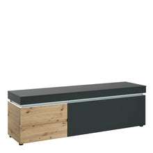 Load image into Gallery viewer, Luci 1 door 2 drawer 180 cm wide TV unit (including LED lighting) in Platinum and Oak Furniture To Go 4390871 5900355117581 The RTV chest of drawers from the Luci collection has two spacious drawers with full extension inside and two recesses behind the flap, which allow you to keep the living room tidy. A 180 cm long table top will allow you to display your favorite RTV equipment. The contrasting combination of the Gray Cosmos decor with the Artisan Oak decor adds a touch of life and freshness to the inter