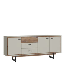 Load image into Gallery viewer, Rivero 3 Door 3 Drawer Wide Sideboard in Grey and Oak Furniture To Go 4466180 5900355153725 The living room and dining room are a space where you can spend time with your loved ones. Daily relaxation, shared meals with the family, as well as parties and feasts in the company of friends are special moments that require reliable and stylish room equipment. As part of the tasteful Rivero series, dedicated to the living room and dining room, there is an extremely spacious sideboard with drawers and full fronts,