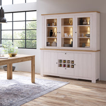 Load image into Gallery viewer, Celesto 2 Door 2 Drawer Sideboard with 3 Door Display Top Unit in White and Oak Furniture To Go 44818542 5060933421971 Introducing our stunning 2 Door 2 Drawer Sideboard with Wine Rack and 3 Door Display Top Unit in White and Oak. With a charming country design, this piece adds a warm and welcoming touch to your home.
Our sideboard is incredibly easy to assemble, making it a hassle-free addition to your furniture collection. The beautiful Larch Sibiu wood grain pattern creates a rustic feel that enhances th