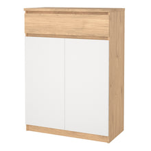 Load image into Gallery viewer, Naia Shoe Cabinet with 2 Doors +1 Drawer in Jackson Hickory Oak &amp; White Furniture To Go 70292209hl49 5713035082259 Experience the perfect blend of style and functionality with the Naia Shoe Cabinet. Designed with a sleek combination of Jackson Hickory Oak and white finishes, this cabinet adds a touch of elegance to your space. Featuring two doors and a convenient black drawer, it offers ample storage for your shoe collection while keeping your entryway neat and organized. With its versatile design and quali