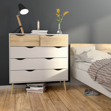Load image into Gallery viewer, Oslo Chest of 5 Drawers (2+3) in White and Oak Furniture To Go 7047545649ak 5060653082537 Alluding a retro modern charm, the Oslo collection has an authentic scandinavian appeal with real style. Dimensions: 1009mm x 987mm x 391mm (Height x Width x Depth) 
 Stylish and trendy 
 High quality laminated board (resistant to damage and scratches, moisture and high temperature) 
 Easy gliding drawer runners 
 Made from PEFC Certified sustainable wood 
 Easy self assembly  
 Made in Denmark 
 Assembly instructions: