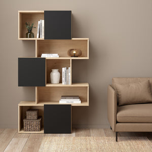 Maze Asymmetrical Bookcase with 3 Doors in Jackson Hickory and Black Furniture To Go 71471738hlgm 5713035083546 Introducing the Maze Open Bookcase—a captivating addition that elevates your living space with its chic Jackson Hickory and Black finish. The asymmetrical design, two-tone colour palette, and spacious 4 shelves allow you to curate your unique showcase of cherished memories and decor pieces. This must-have bookcase exudes sophistication and enduring beauty, adding a touch of style to your home deco
