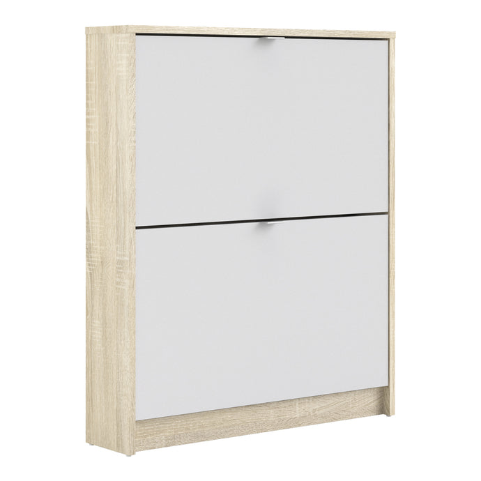 Shoes Shoe cabinet w. 2 tilting doors and 1 layer Oak structure White Furniture To Go 72359001ak49 5713035047647 The Shoes range provides a stylish solution for any cluttered hall. The sleek design allows for plenty of shoe storage without dominating your space. Available with a number of drawers, styles and fronts, the Shoes collection makes for an attractive yet understated addition to your home decor in addition to its practical application. Dimensions: 852mm x 703mm x 166mm (Height x Width x Depth) 
 Th