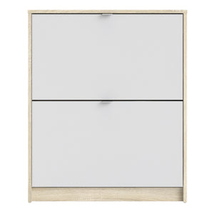 Shoes Shoe cabinet w. 2 tilting doors and 2 layers Oak structure White Furniture To Go 72359005ak49 5713035047722 The Shoes range provides a stylish solution for any cluttered hall. The sleek design allows for plenty of shoe storage without dominating your space. Available with a number of drawers, styles and fronts, the Shoes collection makes for an attractive yet understated addition to your home decor in addition to its practical application. Dimensions: 852mm x 703mm x 241mm (Height x Width x Depth) 
 T