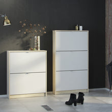 Load image into Gallery viewer, Shoes Shoe cabinet w. 2 tilting doors and 2 layers Oak structure White Furniture To Go 72359005ak49 5713035047722 The Shoes range provides a stylish solution for any cluttered hall. The sleek design allows for plenty of shoe storage without dominating your space. Available with a number of drawers, styles and fronts, the Shoes collection makes for an attractive yet understated addition to your home decor in addition to its practical application. Dimensions: 852mm x 703mm x 241mm (Height x Width x Depth) 
 T