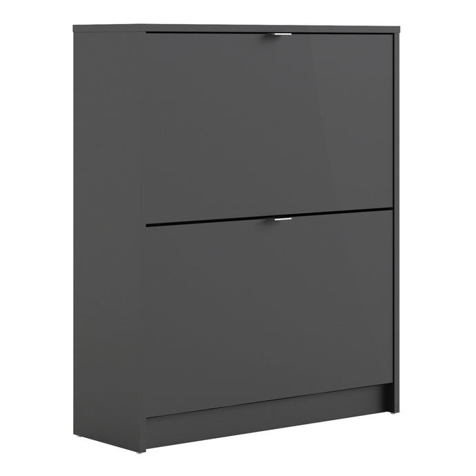 Shoes Shoe cabinet w. 2 tilting doors and 2 layers in Matt Black Furniture To Go 72359005gmgm 5713035051095 The Shoes range provides a stylish solution for any cluttered hall. The sleek design allows for plenty of shoe storage without dominating your space. Available with a number of drawers, styles and fronts, the Shoes collection makes for an attractive yet understated addition to your home decor in addition to its practical application. Dimensions: 852mm x 703mm x 241mm (Height x Width x Depth) 
 This sh