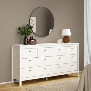 Madrid Double dresser 4+4 drawers in White Furniture To Go 726796634949 5713035068314 A contemporary chest of drawers in an elegant design complete with a simple metal handle, also available in contrasting matt black Dimensions: 797mm x 1594mm x 384mm (Height x Width x Depth) 
 High quality laminated board (resistant to damage and scratches, moisture and high temperature) 
 Made from PEFC Certified sustainable wood 
 Easy self assembly 
 Made in Denmark 
 Easy gliding drawer runners 
 Assembly instructions: