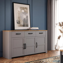 Load image into Gallery viewer, Bohol Sideboard in Riviera Oak/Grey Oak Furniture To Go 801bhlk231-m478 5904767835088 The Bohol collection draws inspiration from its timeless charm and rustic style, embracing its simplicity and natural elegance. What truly sets this collection apart from others is its exquisite decor - featuring three colourways with an Oak finish. The subtle elegance of the light Riviera Oak contributes by adding a focal point to each piece. Also featuring black handles with soft close doors, making it truly stand out in