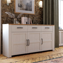 Load image into Gallery viewer, Bohol Sideboard in Riviera Oak/White Furniture To Go 801bhlk231-m482 5904767840525 The Bohol collection draws inspiration from its timeless charm and rustic style, embracing its simplicity and natural elegance. What truly sets this collection apart from others is its exquisite decor - featuring three colourways with an Oak finish. The subtle elegance of the light Riviera Oak contributes by adding a focal point to each piece. Also featuring black handles with soft close doors, making it truly stand out in an