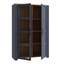Load image into Gallery viewer, Bohol Display Cabinet in Riviera Oak/Navy Furniture To Go 801bhlv621-m348 5904767832292 The Bohol collection draws inspiration from its timeless charm and rustic style, embracing its simplicity and natural elegance. What truly sets this collection apart from others is its exquisite decor - featuring three colourways with an Oak finish. The subtle elegance of the light Riviera Oak contributes by adding a focal point to each piece. Also featuring black handles with soft close doors, making it truly stand out 