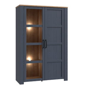 Bohol Display Cabinet in Riviera Oak/Navy Furniture To Go 801bhlv621-m348 5904767832292 The Bohol collection draws inspiration from its timeless charm and rustic style, embracing its simplicity and natural elegance. What truly sets this collection apart from others is its exquisite decor - featuring three colourways with an Oak finish. The subtle elegance of the light Riviera Oak contributes by adding a focal point to each piece. Also featuring black handles with soft close doors, making it truly stand out 