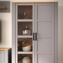 Load image into Gallery viewer, Bohol Display Cabinet in Riviera Oak/Grey Oak Furniture To Go 801bhlv621-m478 5904767835101 The Bohol collection draws inspiration from its timeless charm and rustic style, embracing its simplicity and natural elegance. What truly sets this collection apart from others is its exquisite decor - featuring three colourways with an Oak finish. The subtle elegance of the light Riviera Oak contributes by adding a focal point to each piece. Also featuring black handles with soft close doors, making it truly stand 