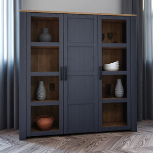 Bohol Large Display Cabinet in Riviera Oak/Navy Furniture To Go 801bhlv631-m348 5904767832285 The Bohol collection draws inspiration from its timeless charm and rustic style, embracing its simplicity and natural elegance. What truly sets this collection apart from others is its exquisite decor - featuring three colourways with an Oak finish. The subtle elegance of the light Riviera Oak contributes by adding a focal point to each piece. Also featuring black handles with soft close doors, making it truly stan
