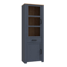 Load image into Gallery viewer, Bohol Narrow Display Cabinet in Riviera Oak/Navy Furniture To Go 801bhlv712-m348 5904767832278 The Bohol collection draws inspiration from its timeless charm and rustic style, embracing its simplicity and natural elegance. What truly sets this collection apart from others is its exquisite decor - featuring three colourways with an Oak finish. The subtle elegance of the light Riviera Oak contributes by adding a focal point to each piece. Also featuring black handles with soft close doors, making it truly sta