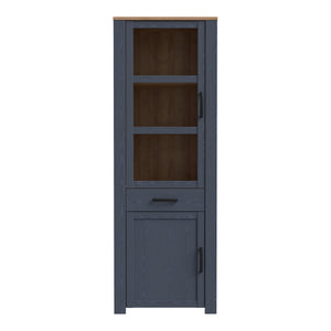 Bohol Narrow Display Cabinet in Riviera Oak/Navy Furniture To Go 801bhlv712-m348 5904767832278 The Bohol collection draws inspiration from its timeless charm and rustic style, embracing its simplicity and natural elegance. What truly sets this collection apart from others is its exquisite decor - featuring three colourways with an Oak finish. The subtle elegance of the light Riviera Oak contributes by adding a focal point to each piece. Also featuring black handles with soft close doors, making it truly sta