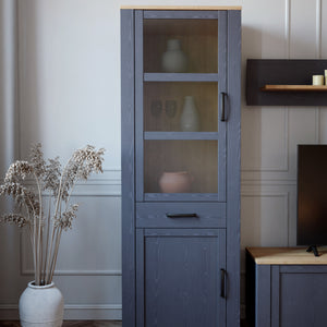 Bohol Narrow Display Cabinet in Riviera Oak/Navy Furniture To Go 801bhlv712-m348 5904767832278 The Bohol collection draws inspiration from its timeless charm and rustic style, embracing its simplicity and natural elegance. What truly sets this collection apart from others is its exquisite decor - featuring three colourways with an Oak finish. The subtle elegance of the light Riviera Oak contributes by adding a focal point to each piece. Also featuring black handles with soft close doors, making it truly sta