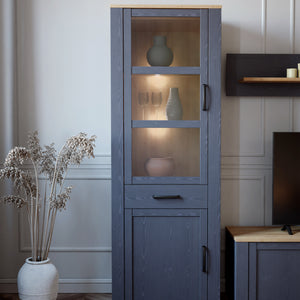 Bohol Narrow Display Cabinet in Riviera Oak/Navy Furniture To Go 801bhlv712-m348 5904767832278 The Bohol collection draws inspiration from its timeless charm and rustic style, embracing its simplicity and natural elegance. What truly sets this collection apart from others is its exquisite decor - featuring three colourways with an Oak finish. The subtle elegance of the light Riviera Oak contributes by adding a focal point to each piece. Also featuring black handles with soft close doors, making it truly sta