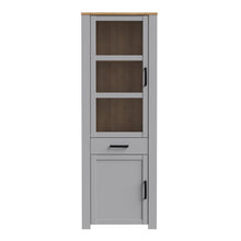 Load image into Gallery viewer, Bohol Narrow Display Cabinet in Riviera Oak/Grey Oak Furniture To Go 801bhlv712-m478 5904767835125 The Bohol collection draws inspiration from its timeless charm and rustic style, embracing its simplicity and natural elegance. What truly sets this collection apart from others is its exquisite decor - featuring three colourways with an Oak finish. The subtle elegance of the light Riviera Oak contributes by adding a focal point to each piece. Also featuring black handles with soft close doors, making it truly