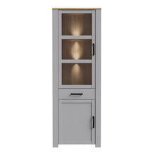 Load image into Gallery viewer, Bohol Narrow Display Cabinet in Riviera Oak/Grey Oak Furniture To Go 801bhlv712-m478 5904767835125 The Bohol collection draws inspiration from its timeless charm and rustic style, embracing its simplicity and natural elegance. What truly sets this collection apart from others is its exquisite decor - featuring three colourways with an Oak finish. The subtle elegance of the light Riviera Oak contributes by adding a focal point to each piece. Also featuring black handles with soft close doors, making it truly