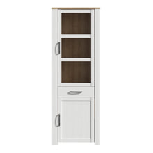 Load image into Gallery viewer, Bohol Narrow Display Cabinet in Riviera Oak/White Furniture To Go 801bhlv712-m482 5904767840570 The Bohol collection draws inspiration from its timeless charm and rustic style, embracing its simplicity and natural elegance. What truly sets this collection apart from others is its exquisite decor - featuring three colourways with an Oak finish. The subtle elegance of the light Riviera Oak contributes by adding a focal point to each piece. Also featuring black handles with soft close doors, making it truly st