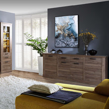 Load image into Gallery viewer, Corona Chest of Drawers in Tabak Oak Furniture To Go 801cr2k241-d64 5904767852641 Discover the captivating allure of the Corona collection, where practicality meets sophistication, the collection offers open recesses, drawers, doors, and shelves. Provide secure and stylish storage solutions with this high-quality selection of furniture. Dimensions: 903mm x 2128mm x 413mm (Height x Width x Depth) 
 Traditional design 
 Dark warm tabak oak effect 
 4 doors 
 2 drawers 
 4 internal adjustable shelves 
 Sturdy 