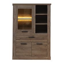 Load image into Gallery viewer, Corona Display Cabinet in Tabak Oak Furniture To Go 801cr2v521l-d64 5904767852689 Discover the captivating allure of the Corona collection, where practicality meets sophistication, the collection offers open recesses, drawers, doors, and shelves. Provide secure and stylish storage solutions with this high-quality selection of furniture. Dimensions: 2120mm x 1084mm x 413mm (Height x Width x Depth) 
 Traditional design 
 Dark warm tabak oak effect 
 , 1 glass door 
 1 drawer 
 3 shelves 
 Optional Lighting 
 