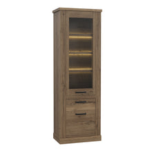 Load image into Gallery viewer, Corona Narrow Display Cabinet in Tabak Oak Furniture To Go 801cr2v812-d64 5904767852719 Discover the captivating allure of the Corona collection, where practicality meets sophistication, the collection offers open recesses, drawers, doors, and shelves. Provide secure and stylish storage solutions with this high-quality selection of furniture. Dimensions: 2120mm x 714mm x 413mm (Height x Width x Depth) 
 Traditional design 
 Dark warm tabak oak effect 
 1 glass door, 1 door 
 1 drawer 
 3 shelves 
 Optional 