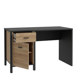 High Rock Desk in Matt Black/Riviera Oak Furniture To Go 801hrkb211l-m197 5904767840693 High Rock, a captivating and contemporary collection which has a perfect blend of the Riviera Oak decor with deep black accents, this collection immediately captivates attention with its originality. The sleek black metal handles add a touch of elegance, while the tables boast robust metal legs in a frame-like design, contributing to a distinct loft character within the space. Beyond its striking aesthetics, High Rock pr