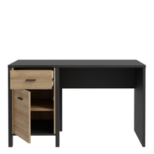 Load image into Gallery viewer, High Rock Desk in Matt Black/Riviera Oak Furniture To Go 801hrkb211l-m197 5904767840693 High Rock, a captivating and contemporary collection which has a perfect blend of the Riviera Oak decor with deep black accents, this collection immediately captivates attention with its originality. The sleek black metal handles add a touch of elegance, while the tables boast robust metal legs in a frame-like design, contributing to a distinct loft character within the space. Beyond its striking aesthetics, High Rock pr