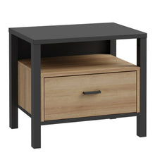 Load image into Gallery viewer, High Rock Bedside in Matt Black/Riviera Oak Furniture To Go 801hrkk011-m197 5904767839635 High Rock, a captivating and contemporary collection which has a perfect blend of the Riviera Oak decor with deep black accents, this collection immediately captivates attention with its originality. The sleek black metal handles add a touch of elegance, while the tables boast robust metal legs in a frame-like design, contributing to a distinct loft character within the space. Beyond its striking aesthetics, High Rock 