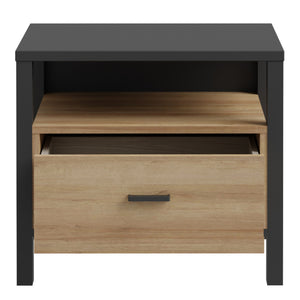 High Rock Bedside in Matt Black/Riviera Oak Furniture To Go 801hrkk011-m197 5904767839635 High Rock, a captivating and contemporary collection which has a perfect blend of the Riviera Oak decor with deep black accents, this collection immediately captivates attention with its originality. The sleek black metal handles add a touch of elegance, while the tables boast robust metal legs in a frame-like design, contributing to a distinct loft character within the space. Beyond its striking aesthetics, High Rock 